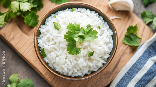 Top view of a vibrant soup bowl with jasmine rice and cilantro garnish