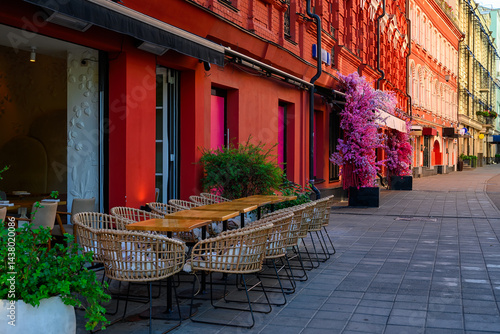 Obraz na płótnie Street with tables of cafe in center of Moscow in Russia. Cozy cityscape in Moscow. Architecture and landmarks of Moscow. w salonie