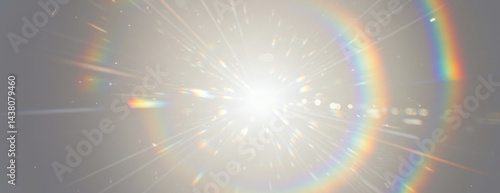 A central light source emits powerful rays and prominent circular rainbow lens flare with abstract ethereal effect, scattered light particles on transparent background