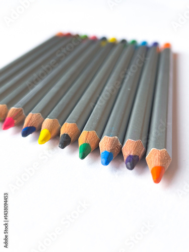 Many colorful pencils on white background