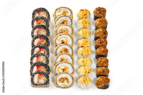 Obraz na płótnie Variety of cooked sushi rolls with black rice, tempura and baked toppings creating a colorful composition on white background w salonie