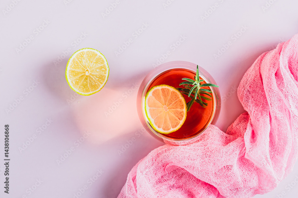 Closeup of alcoholic cocktail pink negroni with lime in glasses on table top view