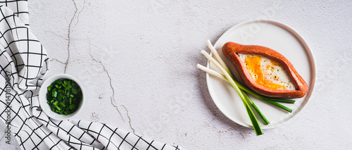 Obraz na płótnie Sausage filled with fried egg and garlic on a plate on a table top view web banner w salonie