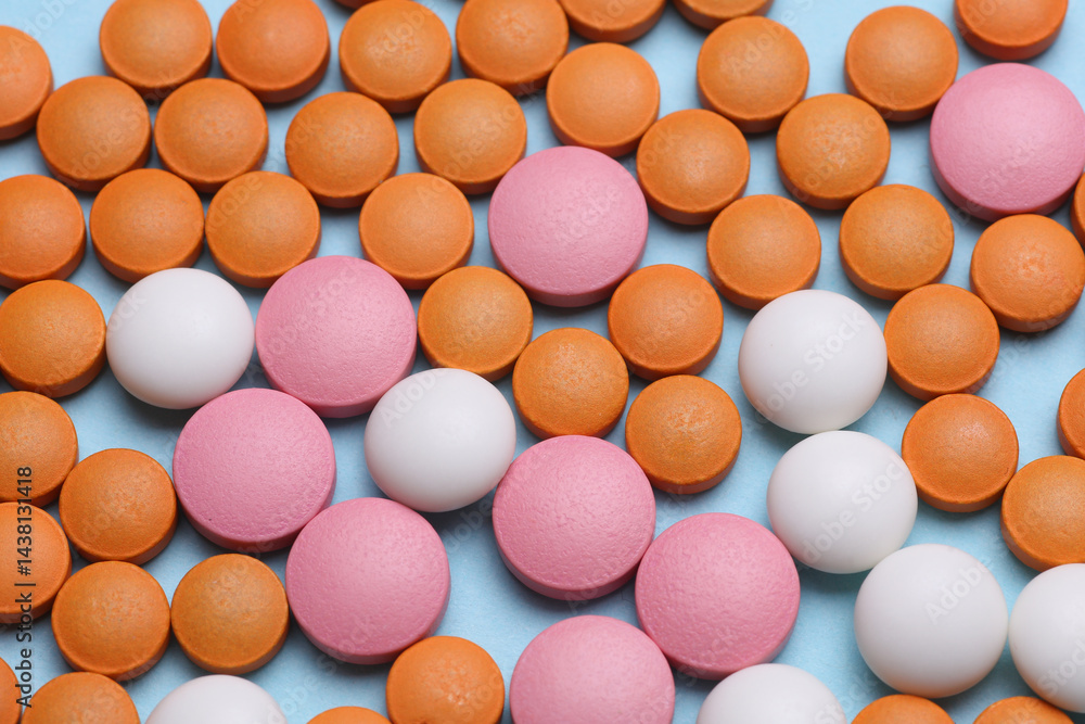 Many different pills on a blue background Many different pills on a blue background