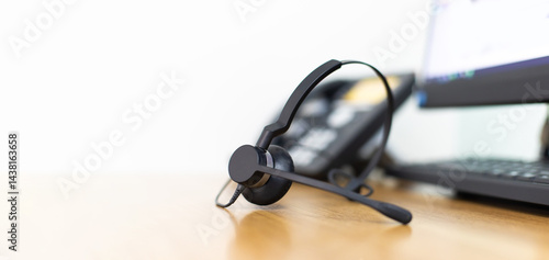 Obraz na płótnie VOIP headset for callcenter on desk at customer service office. Communication support for sale support and telemaketing Helpdeskac w salonie