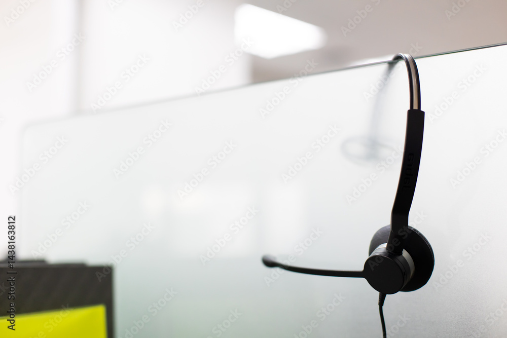 VOIP headset for callcenter on desk at customer service office. Communication support for sale support and telemaketing Helpdeskac