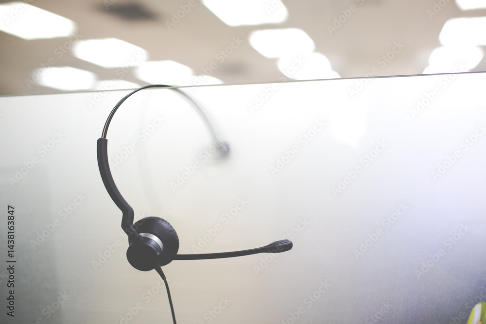 VOIP headset for callcenter on desk at customer service office. Communication support for sale support and telemaketing Helpdeskac