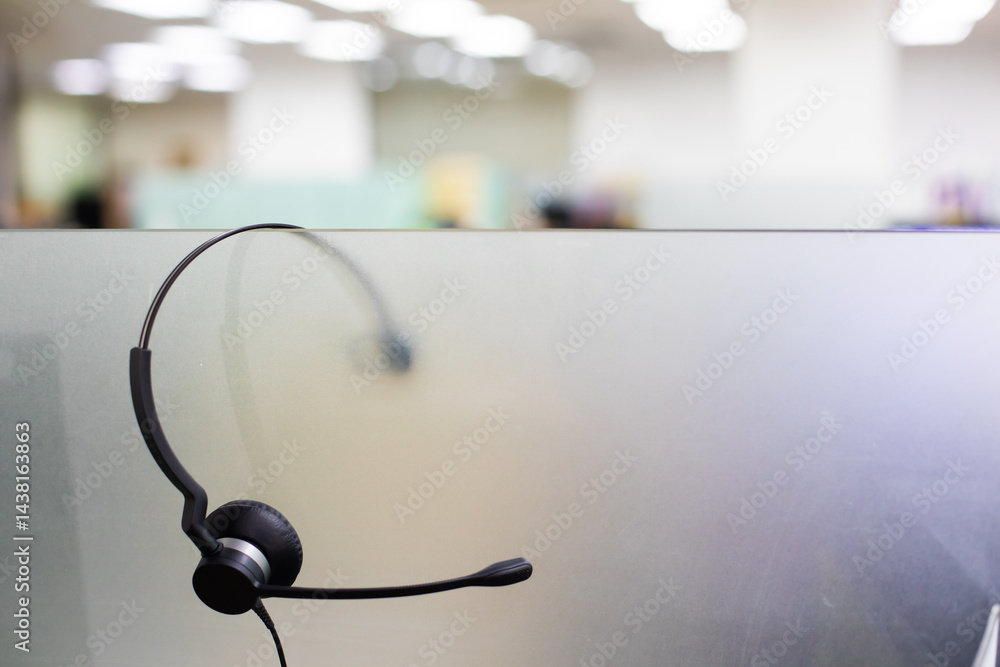VOIP headset for callcenter on desk at customer service office. Communication support for sale support and telemaketing Helpdeskac