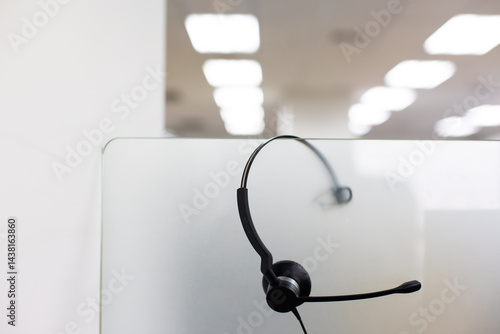 Obraz na płótnie VOIP headset for callcenter on desk at customer service office. Communication support for sale support and telemaketing Helpdeskac w salonie