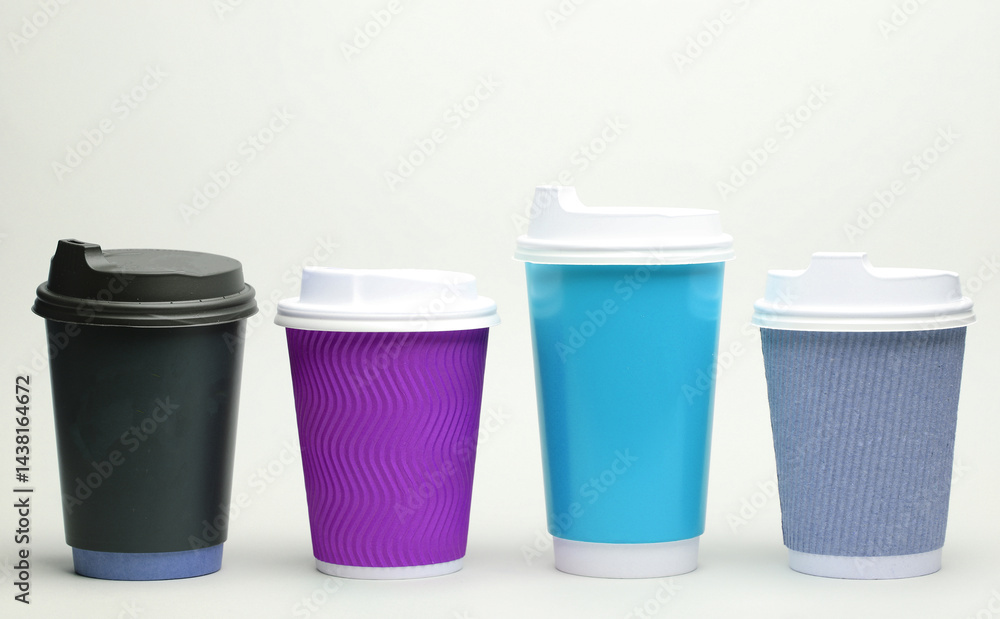 Take-out cardboard coffee cups with lid on white background Take-out cardboard coffee cups with lid on white background
