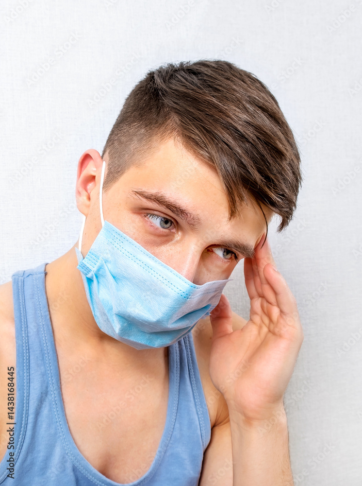 Sad Young Man in Flu Mask