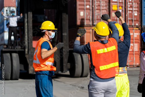 Strike of workers in container yard. Group of multiethnic engineer people during a protest in workplace