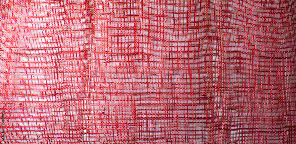 Top view Background texture of red cotton woven fabric.