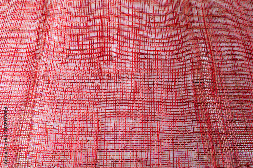 Top view Background texture of red cotton woven fabric.
