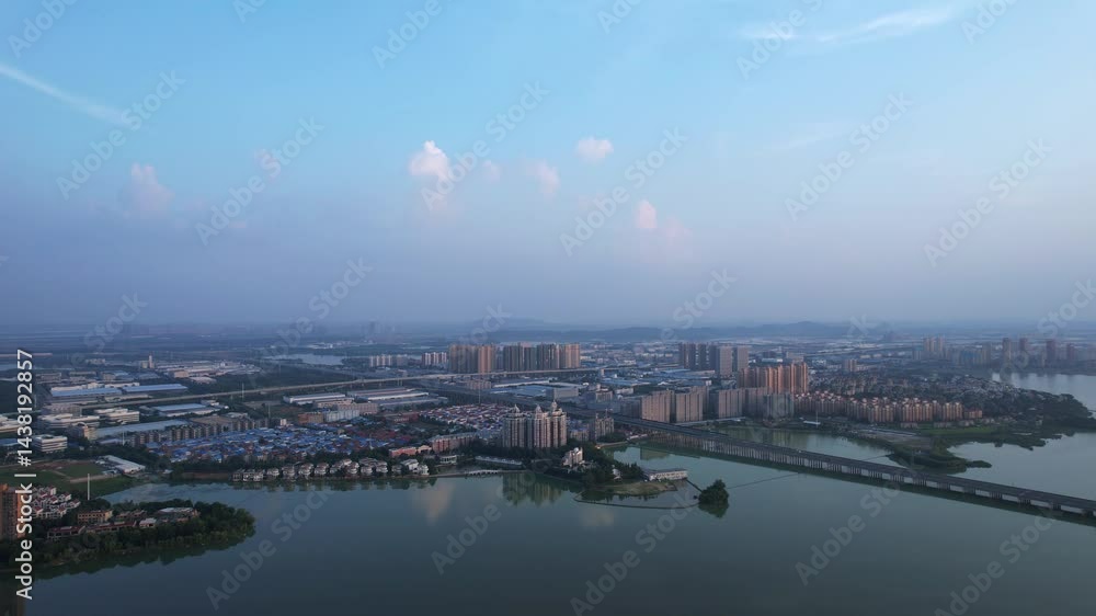 Explore a scenic aerial view of a vibrant city with beautiful lakes and bridges under a blue sky Explore a scenic aerial view of a vibrant city with beautiful lakes and bridges under a blue sky