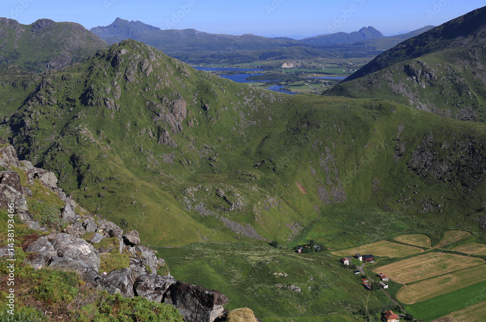 Fototapeta premium Aerial view from the top of the Mount Mannen over the mountains and lakes in the background in the Lofoten Islands, Norway