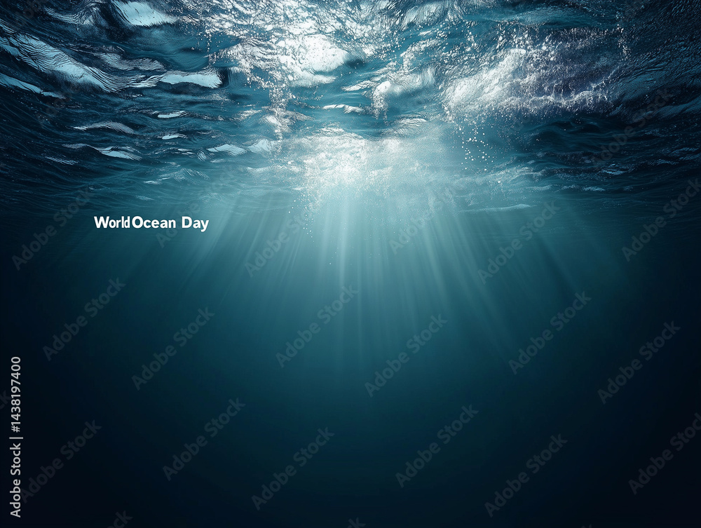 Sunbeams filtering through ocean surface on world ocean day