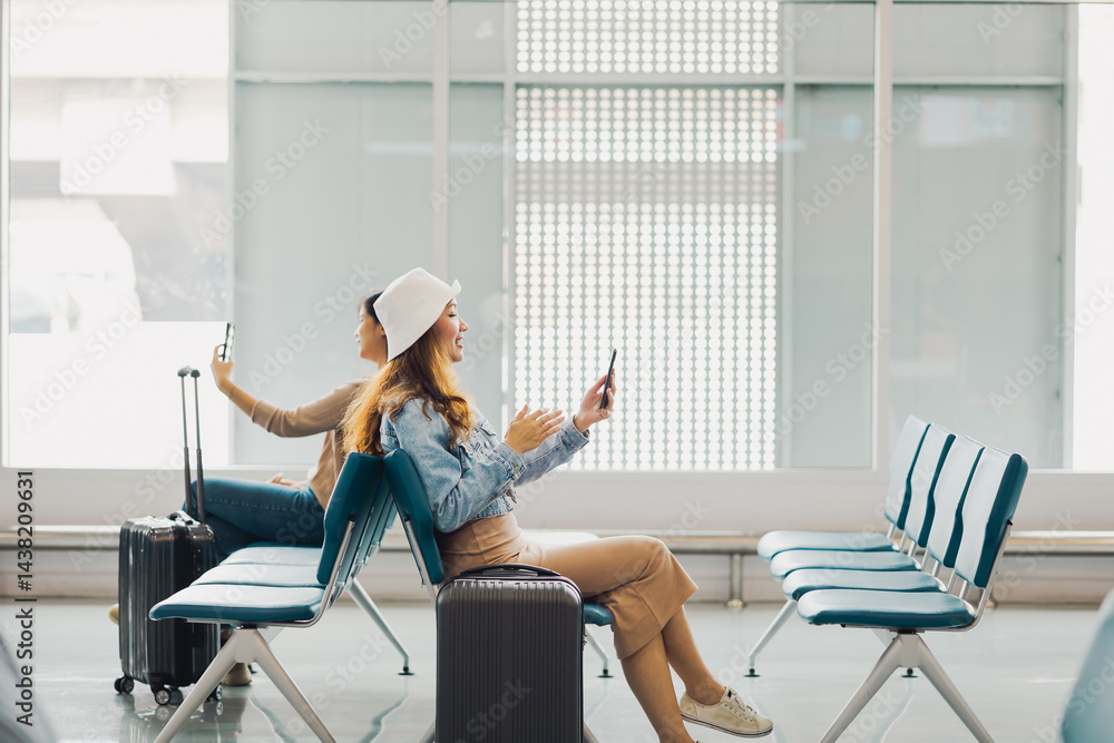 Happy Asian Woman waiting for flight at airport lounge. Happy asian woman passenger traveler waiting for departure with suitcase at modern airport terminal