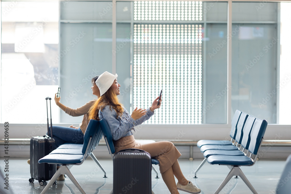 Happy Asian Woman waiting for flight at airport lounge. Happy asian woman passenger traveler waiting for departure with suitcase at modern airport terminal