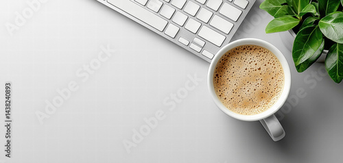 Minimalist photo featuring cup of coffee, computer keyboard, and green plant on light background, creating calm and productive workspace atmosphere