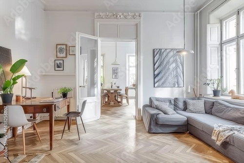 Scandinavian Modern Living Room with White Walls, Wooden Floor, Grey Sofa, and Minimalist Decor