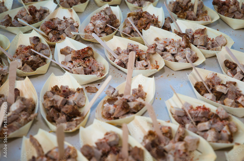 paper stick with small pieces of meat to serve in the catering of a celebration. paper stick with small pieces of meat to serve in the catering of a celebration.