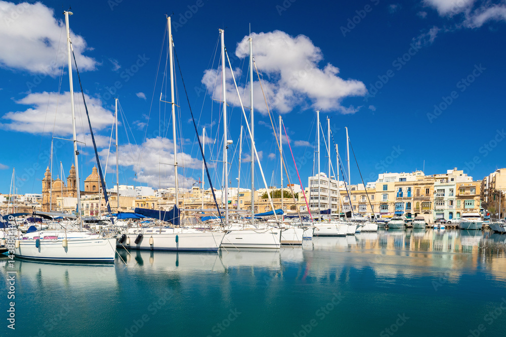Cityscape of the Ta Xbiex bay with yachts lying on water, Malta