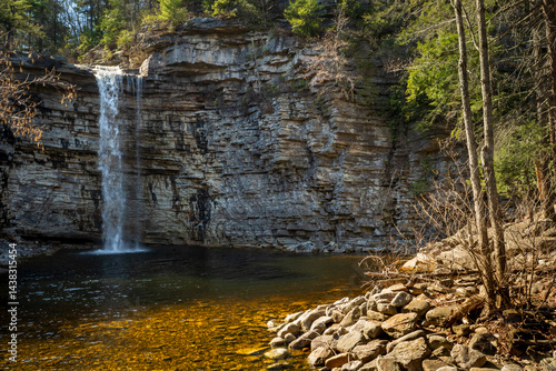 Obraz na płótnie Kerhonkson, NY - US - Apr 23, 2025 Wide view of the Awosting Falls, plunging 60 feet over a dramatic shale cliff into a crystal-clear pool, surrounded by lush forest in Minnewaska State Park, NY. w salonie