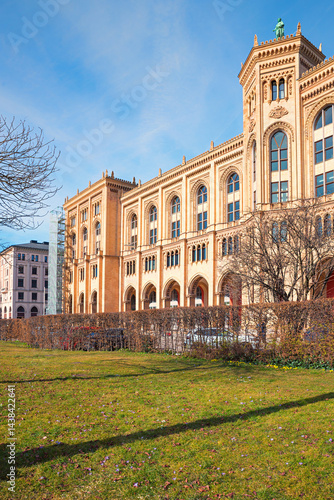 Obraz na płótnie frontside of historic government building of upper bavaria, in april, green meadow w salonie