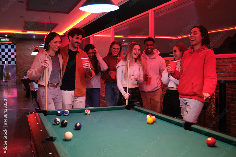 Young people enjoying a game of pool and drinks at a vibrant pub, celebrating friendship and leisure time