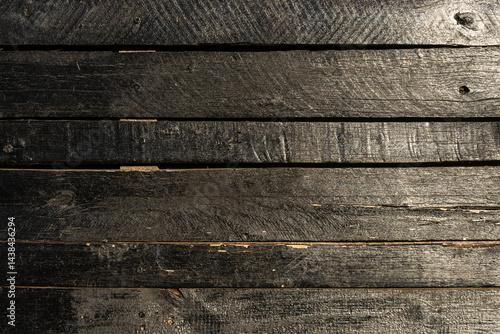 Old wooden fence pattern colored of dark brown. Wood background. Wood texture painted violet closeup. Vintage wooden background in Brazil