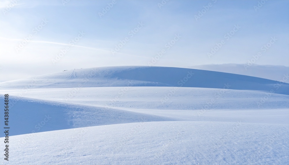 Vast Gently Undulating Snow Covered Landscape Under a Pale Blue Sky. Vast Gently Undulating Snow Covered Landscape Under a Pale Blue Sky.