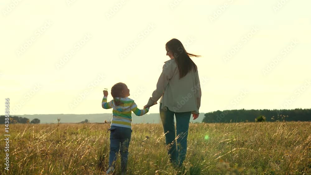 happy family, little girl sunset holding beloved mother by hand, child playing with kite sunset, child playing with wind happy family, dream to fly, kid with mom walking park playing with kite. happy family, little girl sunset holding beloved mother by hand, child playing with kite sunset, child playing with wind happy family, dream to fly, kid with mom walking park playing with kite.