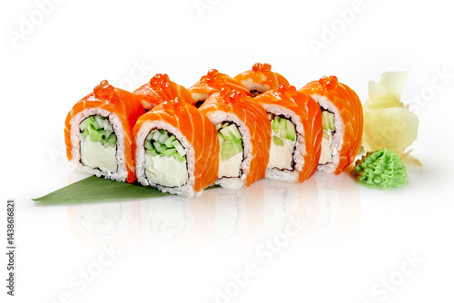 Delicious philadelphia uramaki sushi rolls are garnished with red caviar, served with wasabi and pickled ginger