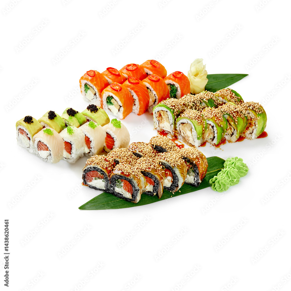 Sushi rolls covered with sesame seeds, salmon and avocado resting on banana leaves