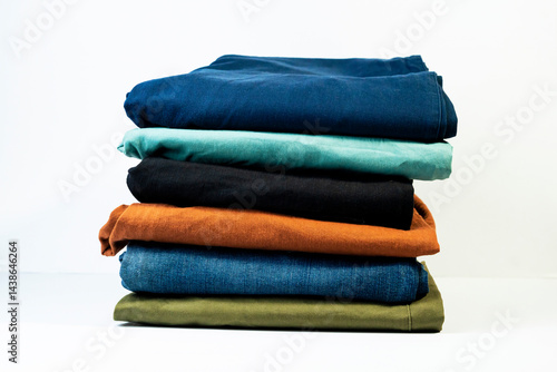 Multicolor casual pants stack for modern everyday fashion isolated on white