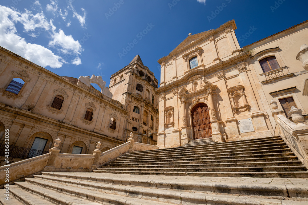 Fototapeta premium View of the churches of San Francesco d'Assisi all'Immacolata and the rear of the church of San Salvatore in Noto, Sicily, Italy, in intense daylight