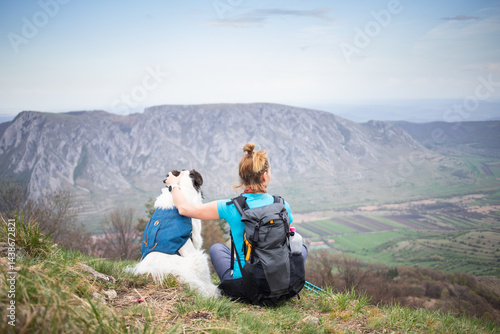 Obraz na płótnie fit woman hiking with her dog w salonie