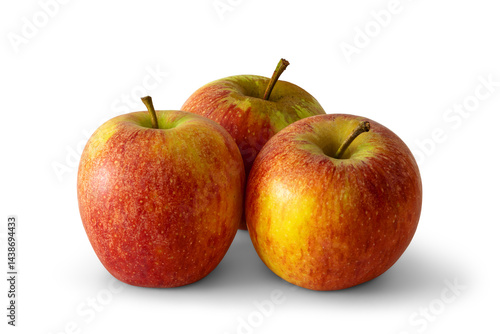Group of three red apples with yellow and green spots, a sweet-tart crisp textured variety, isolated on white background with soft transparent shadows