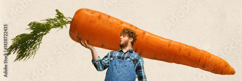 Fotografija Red-haired man, farmer proudly holding giant carrot in hands while looking amazed against neutral background