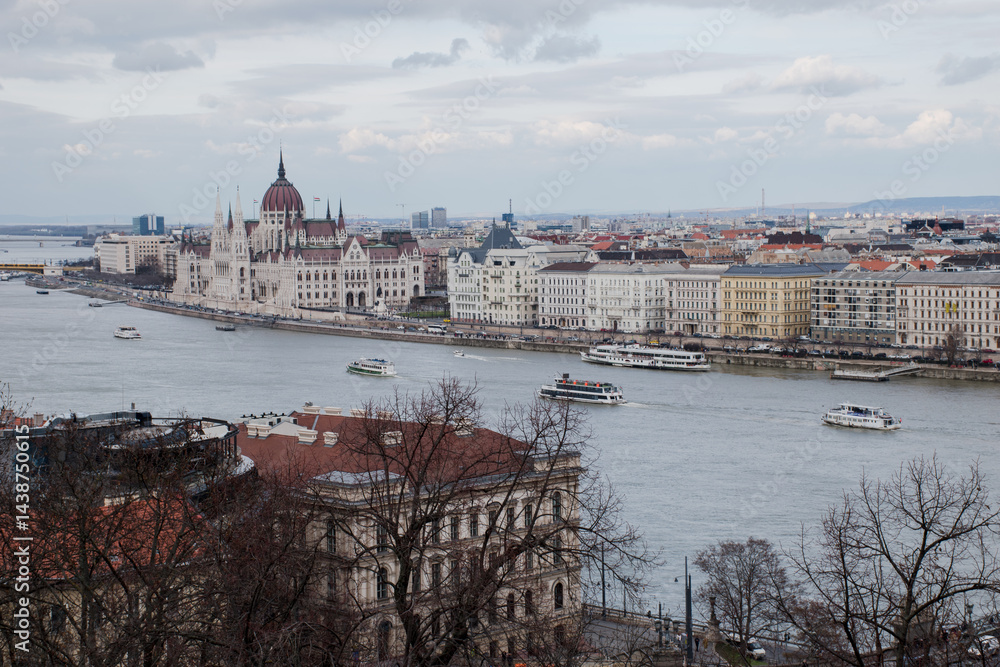 Obraz premium A panoramic view of the city of Budapest in Hungary over the river Danube as seen from Buda Castle; with the parliament building.
