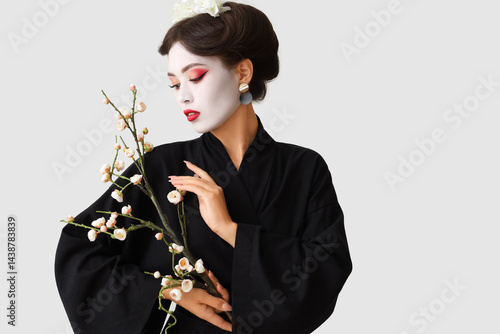 Beautiful young geisha with...