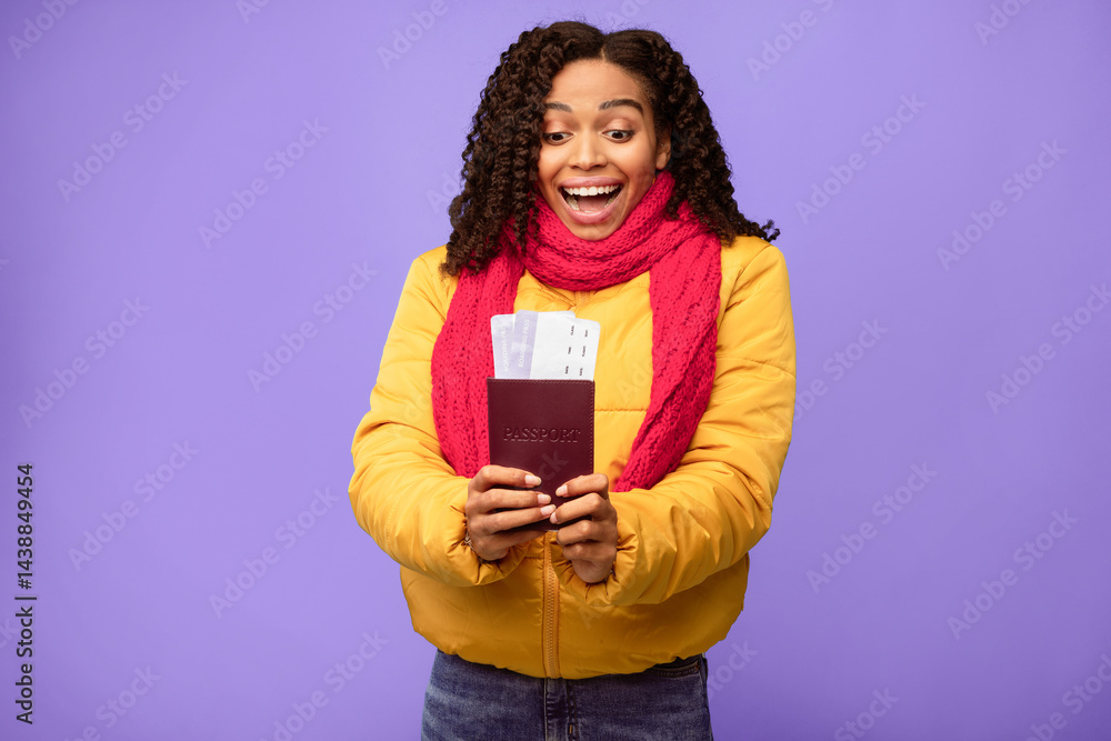 Excited African American Traveler Lady Holding Boarding-Pass Tickets Standing In Studio Over Blue Background. Vacation Finally, Winter Travel And Tourism Concept Excited African American Traveler Lady Holding Boarding-Pass Tickets Standing In Studio Over Blue Background. Vacation Finally, Winter Travel And Tourism Concept