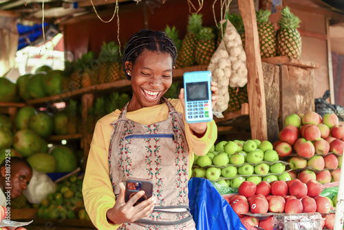 happy active fruit vendor receives mobile payment alert with nfc pos terminal