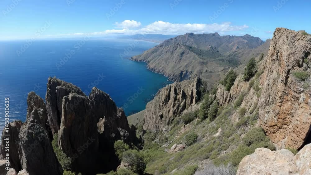 Scenic view of dramatic coastline with rugged mountain peaks and deep blue sea under bright sky, perfect for landscape photography. Scenic view of dramatic coastline with rugged mountain peaks and deep blue sea under bright sky, perfect for landscape photography.