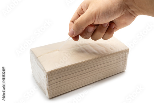 Hand opening Brown tissue paper pack isolated on white background.