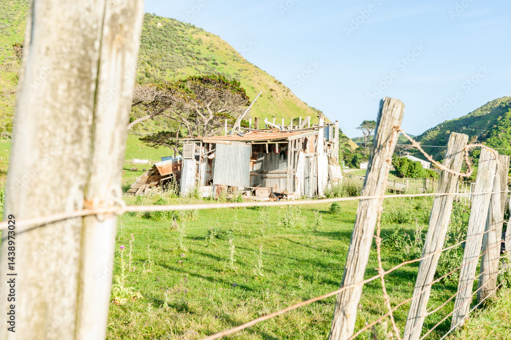 Old tumbled down corrugated farm shed