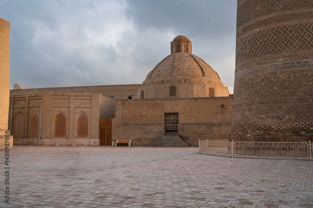 Amir Olim Khan madrasah (Amir Olimxon madrasasi) on the south side of the Po-i-Kalyan architectural complex on a sunny day, Bukhara, Uzbekistan