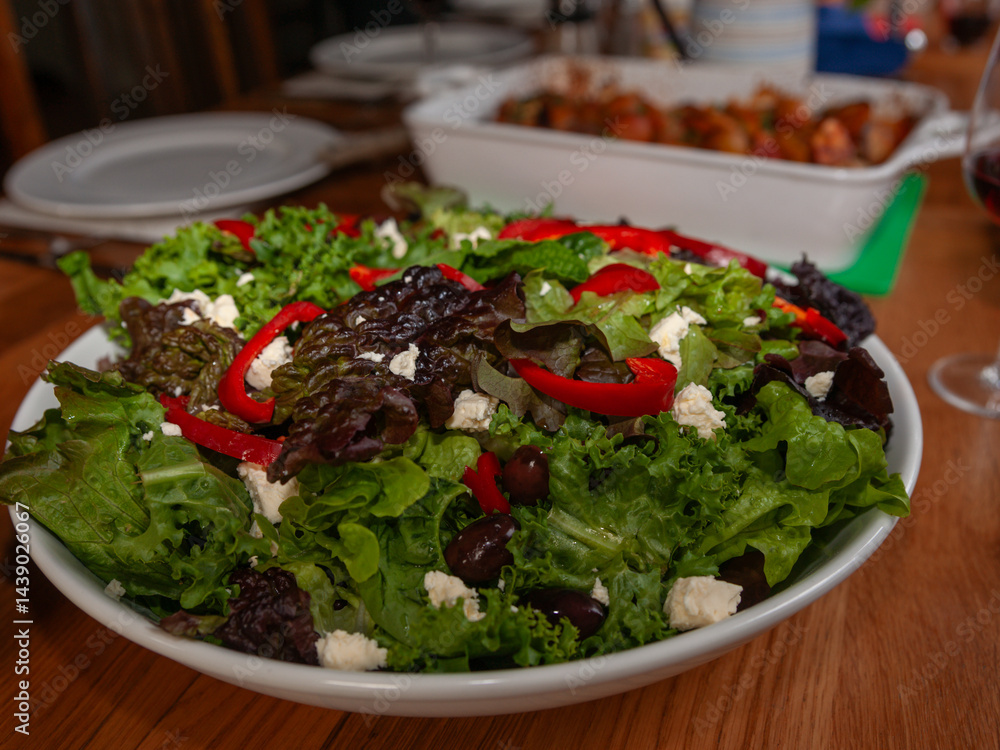 Fresh salad in bowl on table