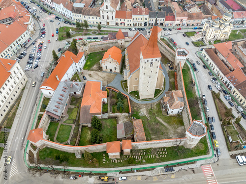 Aerial view of Aiud Nagyenyed fortified protestant church in Romania with walls and towers in the middle of the town